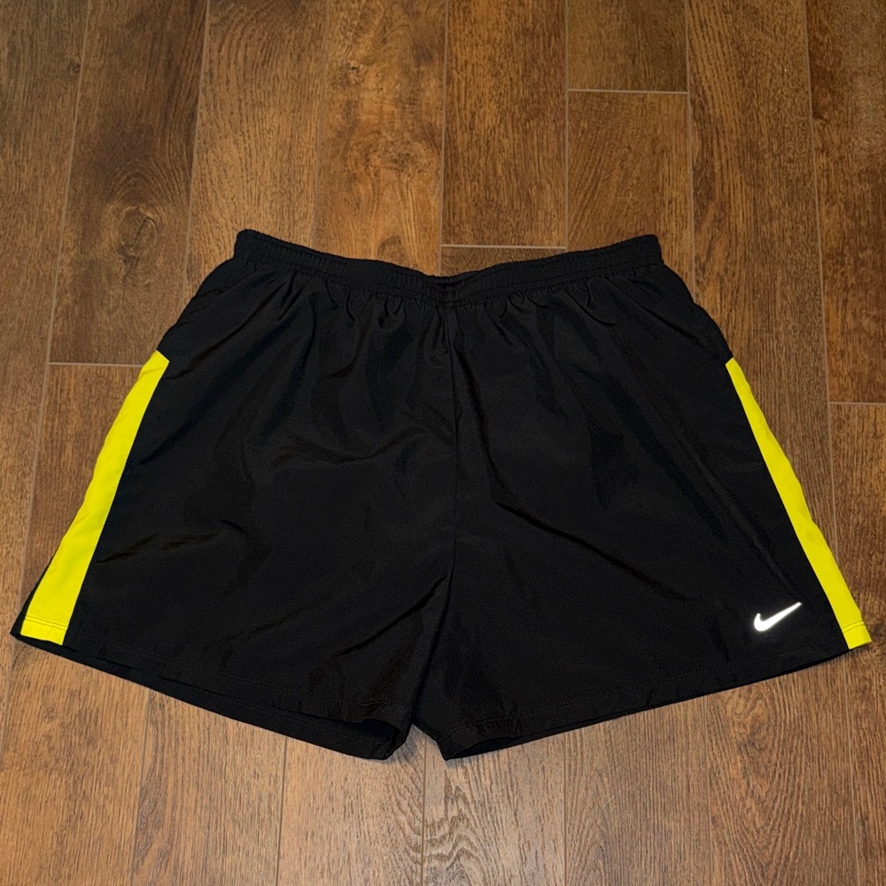 Nike Women’s Black Athletic Shorts with Yellow Side Panels